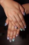 Newspaper print nails and swarovski crystals.