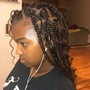 Additional hair added to natural hair style