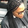 Skinny feed in Braids to the side