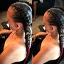 Sleek braided ponytail or bun