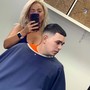 Men's haircut includes edge up with hot towel