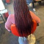 Reg size box braids (below the booty)