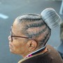 man cornrolls