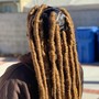 man cornrolls