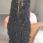 Waist length soft locs.