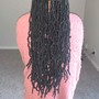 Waist length soft locs.