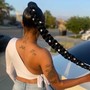 Travis Scott single hanging braids