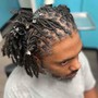 Hi Top Loc retwist- only the top mid section of hair is Loc’d with a nice portion of the back and sides SHAVED not taped.