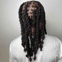 Hi Top Loc retwist- only the top mid section of hair is Loc’d with a nice portion of the back and sides SHAVED not taped.