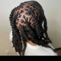 Hi Top Loc retwist- only the top mid section of hair is Loc’d with a nice portion of the back and sides SHAVED not taped.