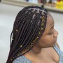 Two lines of individual crochet Locs with the rest hair braided down