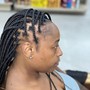 Two lines of individual crochet Locs with the rest hair braided down