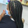 Two lines of individual crochet Locs with the rest hair braided down