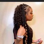 Feed in braids in front and weave in back