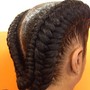 Two cornrows into a bun, or hanging.