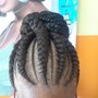 Two cornrows into a bun, or hanging.