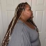 Two feed in cornrows with curly hair on the ends