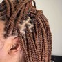 Tribal braids/ half knotless braids.