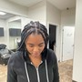 Loc Retwist with two strand twist extensions (mid back)