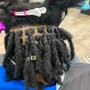 Loc Retwist with two strand twist extensions (mid back)