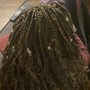 Crochet Braids singles or braided back and hair is attached with a crochet needle