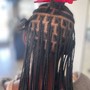 Tribal braids/ half knotless braids.