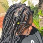 Loc retwist + manbun