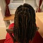 Crochet Braids singles or braided back and hair is attached with a crochet needle