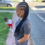 Large individual with 5 braids in the front