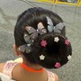 Simple bun Updo for figure skating competition. Glitter spray optional.