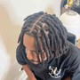 Loc retwist(on head with shaved sides)