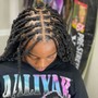 Feed in braids / sew in at the back