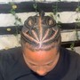 Men corn rolls/stitch braids half of head