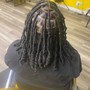 Locs included