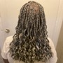 Cornrows in front with tracks in back