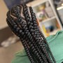 Sides shaved small box braids