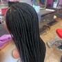 Box Braids pass shoulder length.