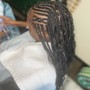 Sides shaved small box braids