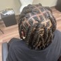 Loc retwist with updo above shoulder