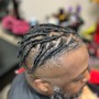 Loc retwist + manbun