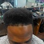 Men's haircut and black fibers