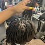 Man and woman locs retwist