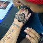 Henna tattoo on hand free hand design