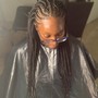 Sleek ponytail with braids added