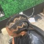 Sleek ponytail with braids added