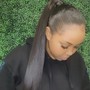 Sleek ponytail with braids added