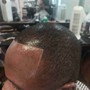 Men's haircut and black fibers