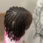 Kid's cornrow feeds in