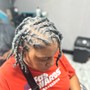 Feed in braids / sew in at the back